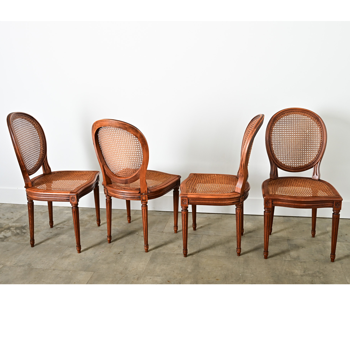 French Set of Four Louis XVI Style Cane Dining Chairs - Fireside