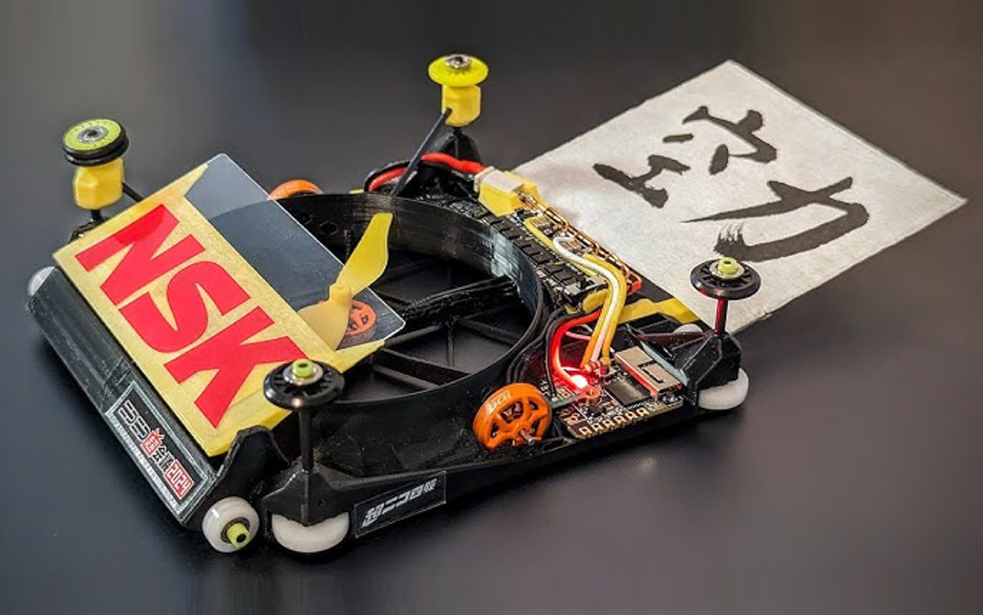 日本精工、ルール無用のミニ四駆“魔改造”タイムアタック大会「超ニコ四