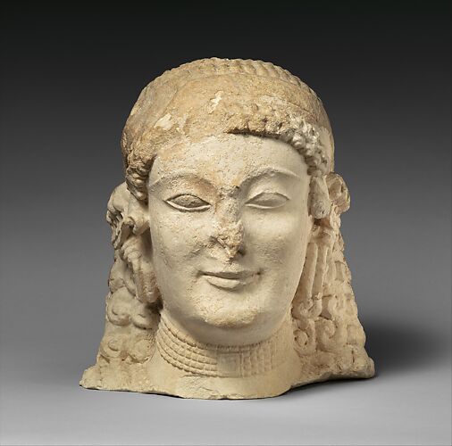 Terracotta head of a woman, probably a sphinx - Greek - Archaic